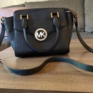 Black Michael Kors purse with removable cross body strap and gold accents